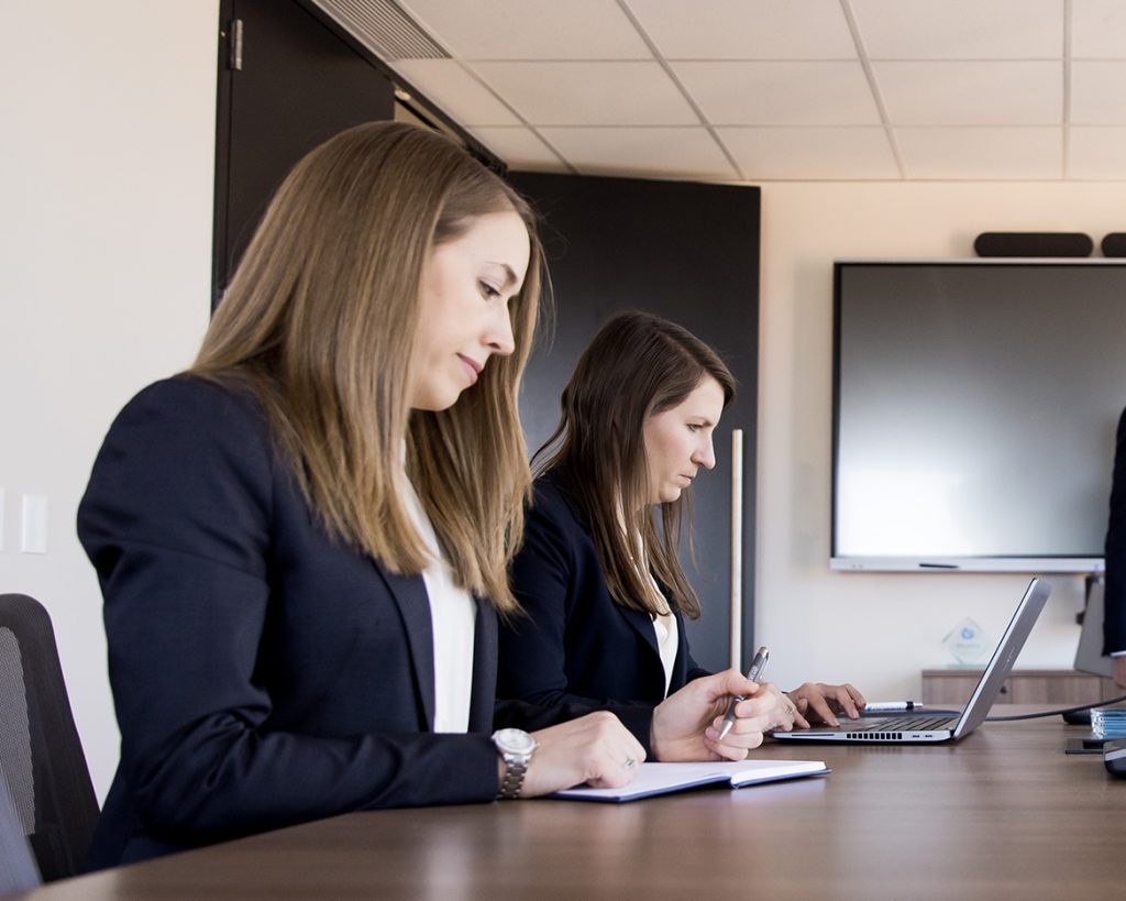 Two due diligence professionals in a meeting