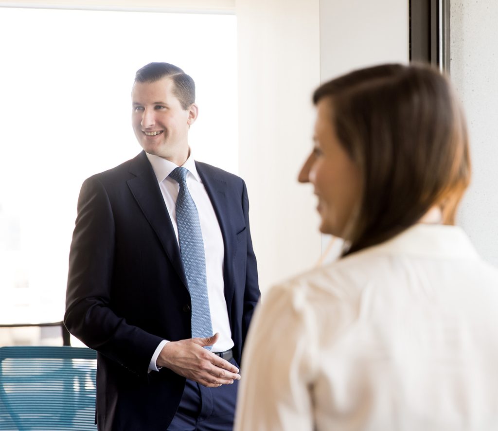 Two due diligence professionals smiling